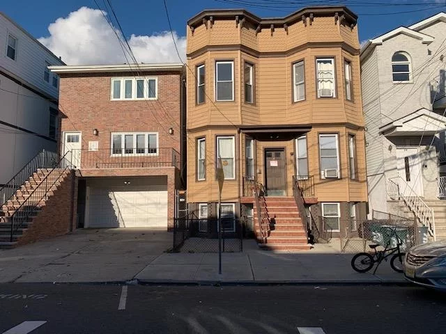 Amazing 4 family property located on a 25x100 sq ft lot in the most desirable Jersey City Heights. Well maintained with 2 units - railroad style on each floor, and an full unfinished basement; each unit has 2 bedrooms/1 bathroom, LR, kitchen; each floor has a storage room for tenants usage; utilities are separated and located in the basement along with 1 full bathroom, office/den; walkout from the basement to a nice size backyard for common use; tenants pay the utilities, owner pays the water. Shingle facing in the front and rear of the building within the last 3 yr.