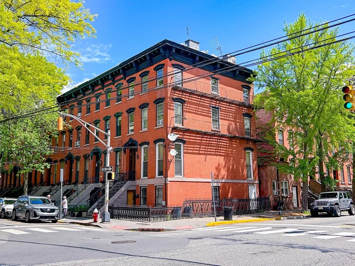 Welcome to 306 Varick, a magnificent multi-unit townhouse located in the prestigious Van Vorst Park neighborhood of Downtown Jersey City. This stunning property boasts beautiful eight-foot windows which allow natural light to flow throughout the space, highlighting the gorgeous hardwood floors and historical adornments throughout the interior. With its perfect location in the heart of Van Vorst Park, 306 Varick is surrounded by a wide range of amenities, including parks, restaurants, cafes, and shops. This prominent corner property boasts views facing East, West, and South which offer picturesque vignettes of the surrounding neighborhood. The unique layout of the lot even includes an additional studio unit in the back, offering the perfect opportunity for investment income. Zoned as a 5-unit building, the incredible bones and massive square footage of this property offer endless design possibilities for someone with a creative eye.  This property is a blank slate, waiting for someone to transform it into their dream home or productive investment property. The seller will require a temporary owner occupancy/lease back (duration tbd). Don't miss out on the opportunity to own this amazing townhouse in Van Vorst Park. Schedule a viewing and see for yourself the potential 306 Varick has to offer!