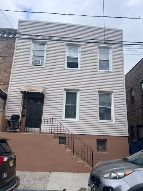 Welcome to 6801 Durham Ave, North Bergen! This income-producing property is now available for sale, offering a fantastic opportunity for investors or owner/landlords. This property features a 3-family front structure along with a separate 2-story single-family home at the rear, totaling 4 legal apartments. The front structure includes three apartments: a ground-level 1-bedroom unit, a first-floor 2-bedroom unit, and a second-floor 3-bedroom unit. The rear house is a solid brick structure, fully renovated, boasting a brand-new kitchen, 2 fully renovated bathrooms, 2 bedrooms, and a family room. Each apartment has separate heat and hot water systems. In addition, the rear house includes a transferable solar panel agreement, (to be installed in a couple of weeks) resulting in a low monthly electricity cost of just $50.00 per month. Rear house will be delivered vacant, and possibly the ground floor apartment as well. Conveniently located just steps from NYC Transportation, NJ Transit Bus 154 to Port Auth within minutes, and Bus 88 to JSQ are just three blocks away on JFK Blvd, this property is a quick 20-minute drive from the city. It's also just a 5-minute drive to the famous Braddock Park, and close to schools, shopping, and a great variety of restaurants offering exquisite dining experiences. This home is being sold in AS-IS condition with no known issues. Don't miss out on this incredible investment opportunity! Open house Sunday 21st from 1-4pm