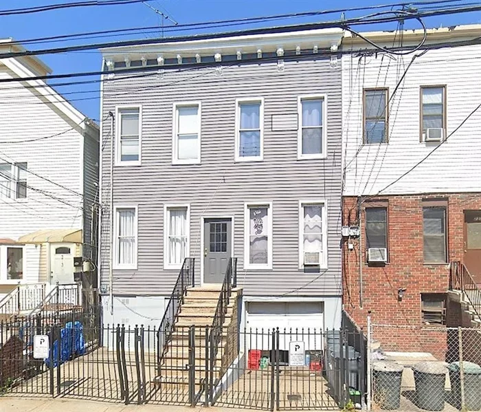 FIRST OPEN HOUSE SUNDAY DEC. 8TH. FROM 1-3PM. Prime 4-Unit Investment Opportunity in Jersey City Heights! Located near Palisade Ave and the popular Riverview-Fisk Park, this well-maintained 2-story building offers four spacious 1-bedroom + den apartments, each with separate utilities. Fully occupied with strong rental income, the property also features three valuable parking spots (2 outdoor, 1 garage), a large backyard with ample potential, and a walkout basement providing convenient storage space. While there is no washer/dryer onsite, a laundromat is just two blocks away. Situated in a vibrant neighborhood, residents enjoy proximity to parks, shopping, cafes, restaurants, and seamless transit options to NYC and Hoboken. This is an exceptional chance to invest in a sought-after area of Jersey City Heights!