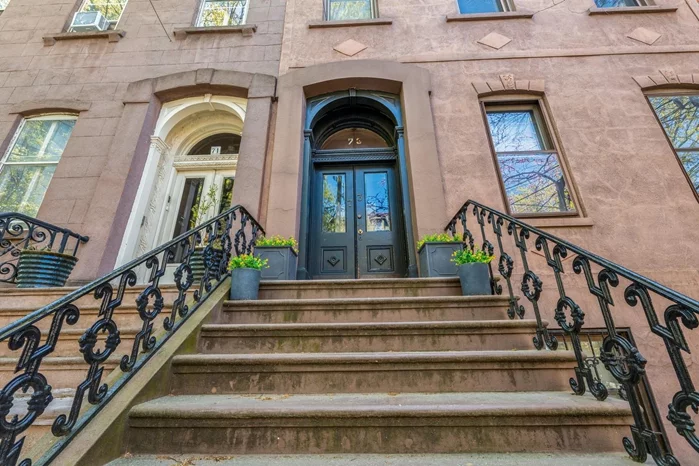 Historic 4-Family Brownstone in Prime Paulus Hook Location. Welcome to this stunning 25-foot-wide historic brownstone in the heart of Paulus Hook, Jersey City's most coveted neighborhood! Situated on an exceptional block just steps from the Hudson River Waterfront Walkway, this property offers a rare opportunity for investors and homeowners alike. Currently configured as a four-family home, this well-maintained brownstone has been under the same ownership for over 35 years, generating outstanding rental income. The property showcases timeless architectural details, including a front yard with the original wrought-iron fence, a grand stoop, and beautiful stained-glass windows. Inside, you'll find generously proportioned rooms, high ceilings, rich moldings, and hardwood floors throughout, offering endless possibilities for customization. Each of the four units offers spacious living with ample storage. Units G, 1, and 3 feature two bedrooms and one full bath, while Unit 2 includes one bedroom, one bath, and a charming patio off the kitchen with an additional room perfect for a nursery or office. Unit 1 enjoys a private deck and shares the backyard with the garden apartment (Unit G). Units G and 1 have washer/dryer hookups in the basement, while Units 2 and 3 include in-unit washer/dryers. Each unit has separate heating, air conditioning, and hot water systems. For added convenience, the property includes a full-sized basement for additional storage and a deeded parking space located just steps away at the corner of Washington and Sussex (available for purchase separately). Located within walking distance of the Exchange and Grove Street PATH Stations, multiple Citi-Bike stations, Light Rail, and the ferry, this home offers unmatched access to public transportation and city amenities. The seller is open to discussing interest-only financing for part of the purchase price. Floor plans are available upon request, and we can connect you with architects and builders if you choose to renovate and customize the space to suit your needs. This exceptional property combines historic charm with tremendous potentialdon't miss your chance to make it your own!