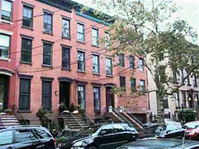 MAGNIFICENTLY RESTORED BROWNSTONE, 3 FM BUT LEGAL 4 FM, OWNERS TRIPLEX W FORMAL DR, LIBRARY AND ROOF DECK, PLUS 2 ADDITIONAL APTS W COMBINED RENTS OF 3400 PER MO, HOME IN MINT CONDITION, READY FOR YOUR CLIENTS TO MOVE IN.