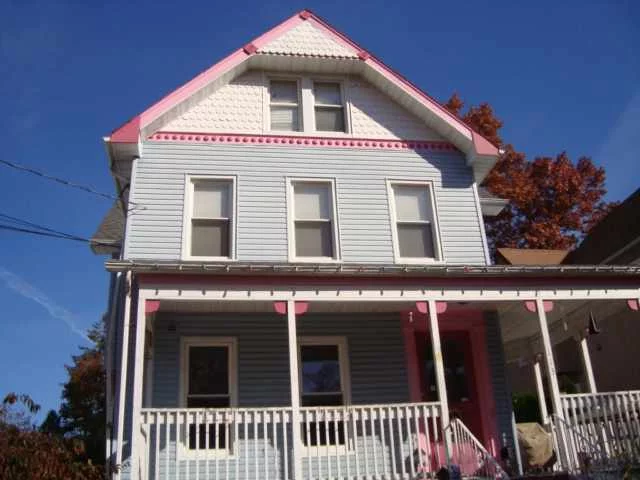 This country Edwardian is located in the desirable Montclair township and it is offered at a very attractive price. With a little TLC this 3 FAMILY beauty will join the the row of beautiful Victorian homes in the neighborhood. The home features hwd floors throughout, high ceilings, original crown molding, stainless steel appliances, big bay windows, EIN kitchen and a huge yard with 3+ cars detached covered garage. The exterior has a dollhouse effect with detailed architectural designs and colors. Must see.