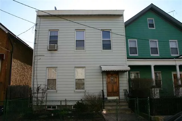 Cute 2 family starter home in Jersey City Heights on New York Avenue, great location, original Hard-Wood Floors, newer rubber roof approx 5 Yrs old, newer windows throughout approx 10 yrs old, access to back yard from both apartments...minutes to Hoboken and one block to Palisade Avenue, near Congress Street Light-Rail Station...call today!