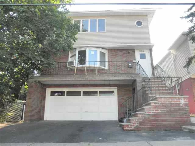 EXCELLENT LOCATION CLOSE TO ALL SHOP, MAJOR NYC TRANS, SCHOOLS. A LOT OF WORK DONE & RENOVATION ON THIS PROPERTY.. NEW SIDING, NEW GAS BOILERS, NEW KITCHENS WITH GRANITE COUNTER TOPS AND STAINLESS STEEL APPLIANCES. 3 LARGE BED ON EACH FLOOR. BASEMENT IS FINISHED WITH A FULL BATH AND A PRIVATE ENTRANCE. OVERSIZED 2 CAR GARAGE.