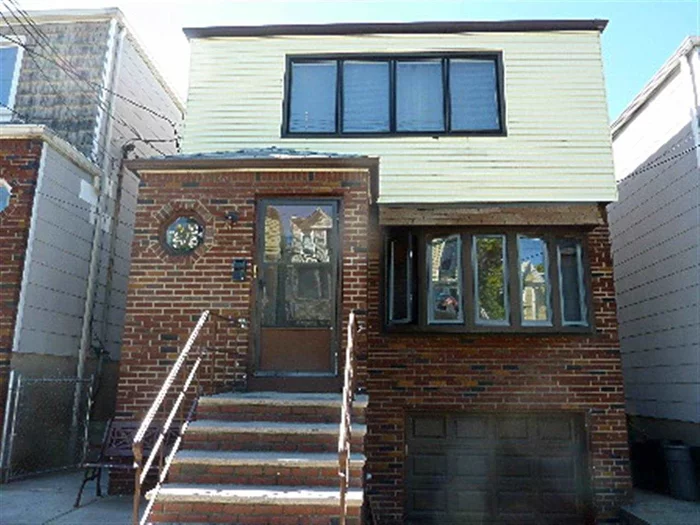 HOUSE IS BEING SOLD AS-IS. NEW CABINETS ON FIRST FLOOR, STAINLESS STEEL REFRIGERATOR ON FIRST FLOOR NOT INCLUDED. UNIT 1 HAS THREE BEDROOMS AND AN EAT-IN KITCHEN OCCUPIED BY OWNER. UNIT 2 RENTS FOR $1200/MONTH AND HAS A SEPARATE DINING AREA.  HAS GARAGE, ABOVE GROUND POOL AND BACKYARD. BASEMENT HAS KITCHENETTE AND SHOWER STALL. PRICED TO SELL!!