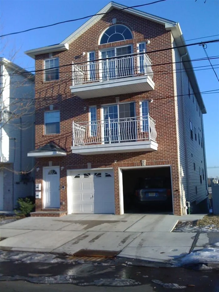 Enjoy the security of rental income in this 2FM home on an oversized lot. Home is only 7 years young, 2 car garage, extremely spacious, large bedrooms, w/plenty of closet space, open floor living room to dining room with open kitchen, high ceilings,  2 terraces with NYC views, h/w floors, washer and dryer in both units, common yard,  steps to NYC transportation, minutes from the Garfield Lite rail, schools, shopping, great potential. Must see to appreciate ,