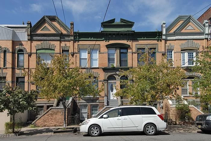 Beautiful Victorian Row House with many old world features. Structurally sound with unlimited potential. Move-in ready 2 family with income bearing rental on ground floor. Owner's duplex above features open layout with large kitchen, huge living room with vaulted ceilings, exposed brick and picture window. Second floor boasts 3 bedrooms and a center hallway full bath with skylight.