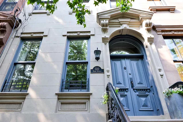 2 fam Brownstone half block from Van Vorst park in dwtn JC. Owner's 3BR, 2.5BA triplex w/ garden level studio rental. Original details thru-out w/ original marble mantles, built in shutters & ornate molding. 2 zone A/C. Rec. renv kitchen w/ all Viking appls, marble counters. Top flr master suite w/ skylight, 3 lg custom closets incl walk-in. Lg 5 piece BA. Sep office and laundry room off master w/ ample storage. Deck off kitchen w/ stairs to landscaped yard w/ fountain. Full bsmt.