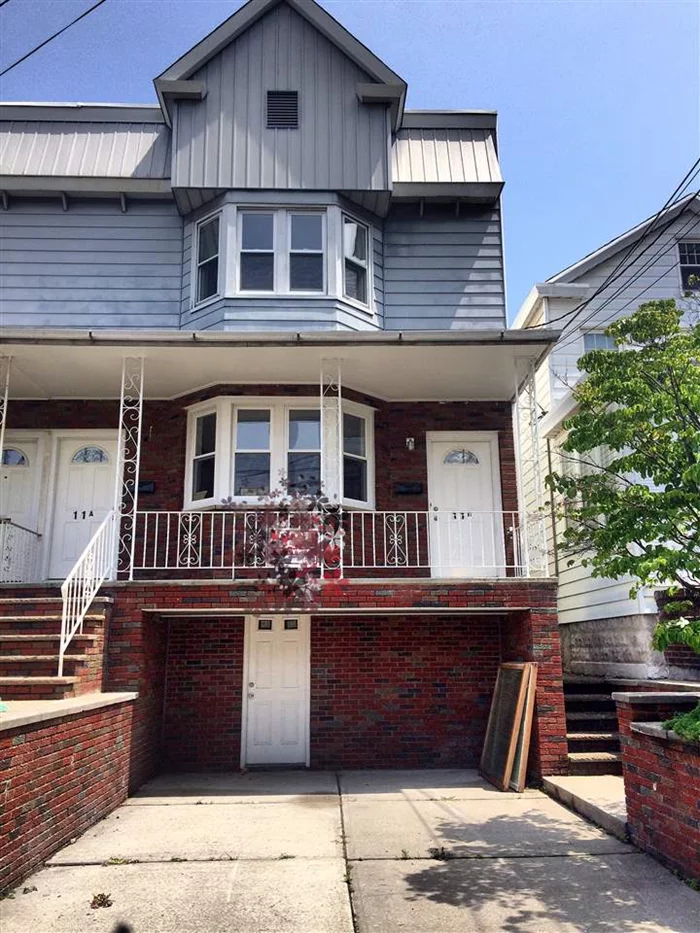 Beautifully Renovated 2 Family House w/Parking Featuring wood floors, open kitchen with dining area, stainless steel appliances, 2 decks with yard. great location right by broadway.