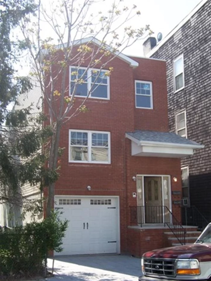 Very Nice Two Family Home located 3 Blocks from Liberty State Park Light Rail. Hardwood Floors throughout, 2 Full Bathrooms on each Apartment. Separate Living Room and Dining Room, Laundry Room and Back Yard.