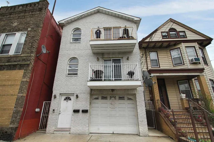 Solid 10 year old 2 family house in Jersey City, Bergen Ave. Second and third floor units are identical: three bedrooms, 2 full baths, open layout living room and dining room, kitchen with a dishwasher. Central air throughout, hardwood floors. There is a bonus 1 bedroom unit on the ground floor. One car covered garage, and a back yard.