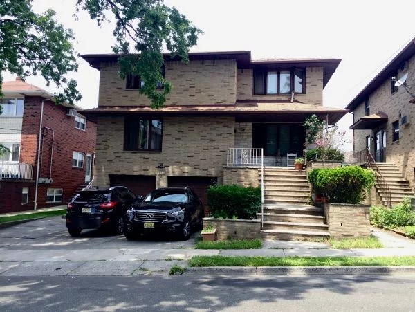 Sprawling Solid Brick Detached 2 Family with 2 Garage with Additional 2 Open Parking Spot, Large Lot Coverage 50X100, Faces East, Great Rental Income. Large Yard and Apt 2 has deck. Very Nice Block with Easy transport to NYC via Bus. Near Turnpike entrance and short distance to GW Bridge to NYC.