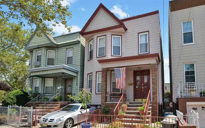 This two family house is ideally located in Jersey City Heights, just a 5 min walk to Congress Light Rail Station which connects to Path. Second floor offers 2 bedrooms, den/office off the master bedroom, with one full bathroom, living room, separate dining room, a newly renovated kitchen with S/S refrigerator, stove, built in microwave and a breakfast bar. A deck off of the kitchen overlooks a beautiful oasis backyard, with large above the ground pool, and fruit trees. First floor features 3 bedrooms, one bathroom, living room, dining room and eat in kitchen. There is also a bathroom on basement level. Parking for one car. Located close to parks, shopping and restaurants!