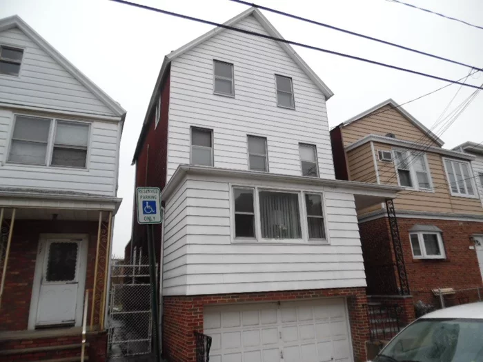 TWO FAMILY HOME FEATURING 11 ROOMS, 4 BRS, 3 BTHS & ONE CAR GARAGE PARKING. NEEDS TLC. IDEAL INVESTMENT OR OWNER OCCUPIED HOME. PRIME MIDTOWN LOCATION. NEAR ALL TRANSP, SHOPS & SCHOOL.