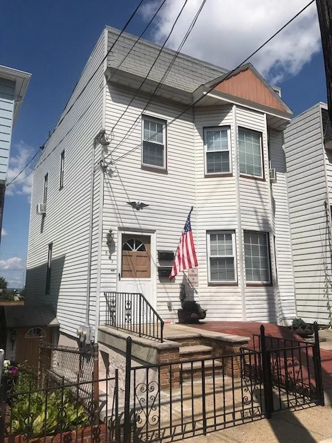 MODERN 2 FAMILY HOME FEATURING 2 AND 3 BEDROOM APARTMENTS WITH TILED BATHS AND SEMI-FINISHED BASEMENT WITH HALF BATH. LOCATED IN THE PRIME JERSEY CITY HEIGHTS WESTERN SLOPE AREA CONVENIENT TO NYC BUS TRANS, MAJOR HIGHWAYS, SHOPPING AND SCHOOLS