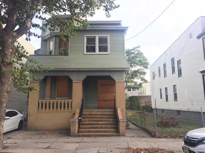 Divisible lot, once city permission obtained by buyer. New two family homes are selling for $560, 000 and higher in the immediate area. Nice block near NJ-440 shopping. Hot investment area. Existing vacant home has some limited fire damage on the first floor. Bring your best offers!