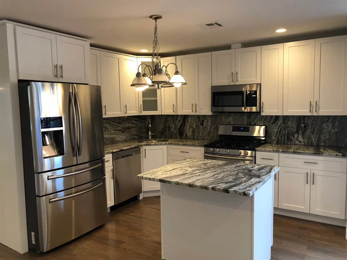 WONDERFUL OPPORTUNITY TO OWN 2400+ SQ FT GARAGE ON 1ST FL CURRENTLY RENTED FOR $2000 PER MONTH. 2 UNITS ABOVE. UNIT 2 WAS JUST TOTALLY RENOVATED ANY READY FOR NEW OWNER.TO SHOW CALL SHOWING TIME. . THE SELLER HOLDS AN ACTIVE NJ REAL ESTATE BROKERS LICENSE