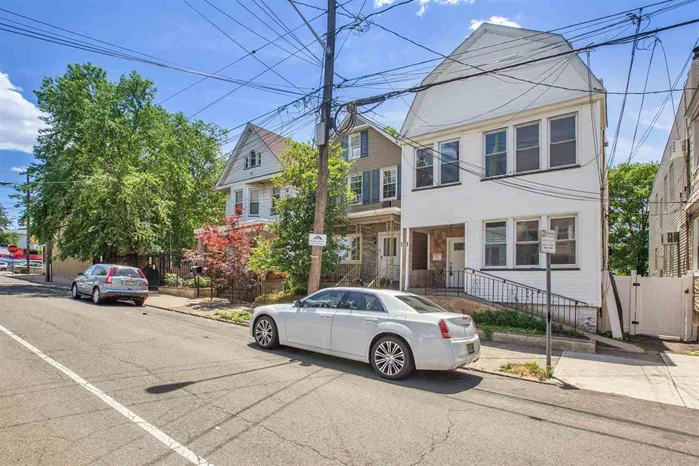 Beautiful totally renovated two family colonial located in West Bergen section. This exquisite home offers 6 bedrooms + 2 dens, 2 full baths (4th bedroom on second floor could be used as a dining room) , and remarkable natural light. Modern kitchens featuring granite counter tops and new SS appliances. Separate heat & hot water units. Spacious full basement. The back yard is huge with full deck and is perfect for summer BBQs. Enjoy an easy commute to NYC with bus stop one block away.