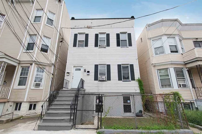 Calling all investors or owner occupiers! This two family income producing property is in a prime location near the Richard Light Rail station and Bayside Park.