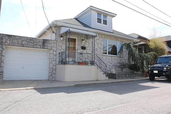 Sitting on a spacious 3, 241sq.ft lot, this spectacular income earning 2 family, with unobstructed NYC views from the George Washington Bridge all the way south to the Battery, make this home a rare opportunity to own a Cliffside Park gem. With 2, 101 sq.ft of living space, $22k a year in rental income which covers operating expenses and taxes that are considerably lower than newer construction, this home also offers garage parking for two cars and so much more.  The amazing yard, built out over the cliff, has a terraced area covered by a beautiful grape arbor and a grassy area. Unobstructed views of the city and the Hudson River can be seen from all the rear windows of both units. Come take a look and fall in love with this amazing location! Open House this Sunday, April 7th, from 1pm to 3pm!