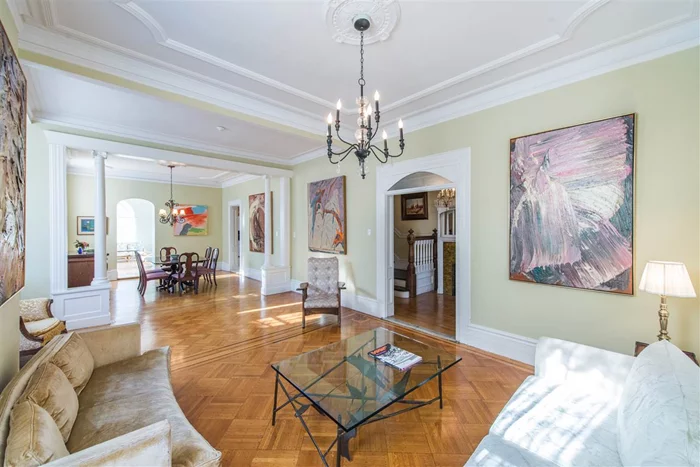 A rare opportunity to own a piece of Hoboken grandeur. Welcome to 800 Hudson Street, a stately, late-Victorian residence offering over 4200 sq. ft. of living space on a 24.71 x 88 corner lot, along with private parking. This massive two-family property is comprised of a light-filled owner's triplex and garden level apartment. Enter the impressive parlor level through a welcoming foyer with a gorgeous tiled mantle and grand staircase with vintage balustrades, and you'll immediately appreciate the scale of this fine home and its many period details. To the left, an expansive living and dining area with original moldings and classic hardwood flooring, and the adjoining solarium is perfect for hosting a weekend brunch. With 7 bedrooms and three full baths, enjoy abundant room to design the perfect live, work, rest and entertaining spaces. A garden level apartment with separate entrance and an updated kitchen can provide rental income or au pair suite, or reimagine into a rec room, home office, playroom, craft space  whatever you dream. Fresh brick pavers cover the large private parking area, with front and side gardens for your green thumb. Brilliant sunlight throughout from three exposures, lofty ceilings and original hardwood flooring. A truly special home with endless possibilities, located in the center of everything Hoboken has to offer. Call today for your private tour of this magnificent property.
