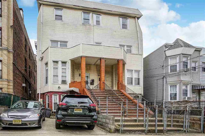 When a 2 family with 12 bedrooms becomes available to purchase in Journal Square, you simply buy it. You buy it because of its potential maximum gross rent opportunity. Previously a 3 family, an easy conversion back will give you that best case scenario. Investment IQ: impressive lot size at 143 X 25, separate utilities, 2 car parking, low taxes, attractive future market rents, and its ideal location-between Kennedy Blvd and West Side ave makes this an exciting purchase! In and out of the city, no problem; short distance to Path and Lincon Park nearby. There's more to love; tall structure with strong bones, high ceilings, and great character gives it a certain charming appeal. See what else appeals to you, book your showing today.