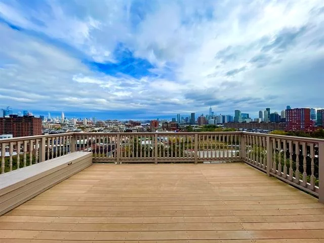 Enjoy spectacular NYC views from your living rooms and private rooftop on Ogden Ave in Jersey City Heights with 2 car garage. This well maintained 2-family + bonus unit on ground level that has potential to be a 3rd legal unit. Located on the eastern side of Ogden Ave has fantastic rental potential. Unit #2 has 3 bedrooms + den, 2 bathrooms and a private rooftop terrace. Unit #1 has 3 bedrooms, 2 bathrooms, as well as direct NYC views and a terrace. The bottom floor is a bonus unit with 1 bedroom, 1 bathroom, and access to the private yard. The building includes central AC, an oversized 2-car garage, oversized driveway and laundry in each unit.