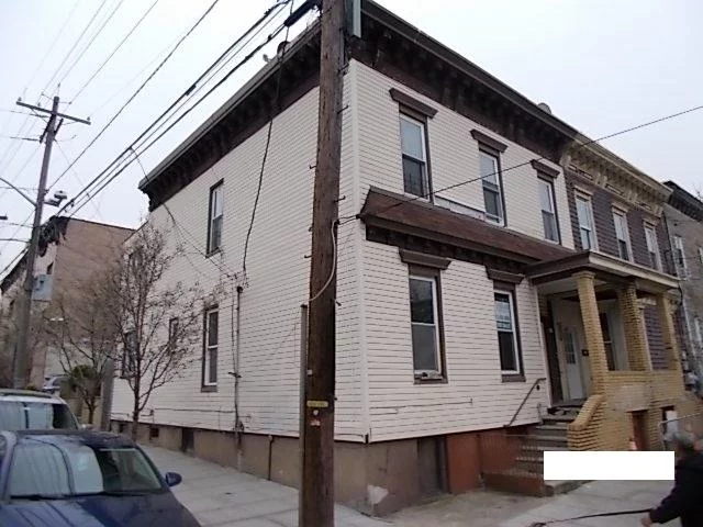 Large 2 family with 6 total bedrooms and a finished basement. Property sits on the corner of West Street and 18th Avenue and is in a prime location. Property needs work including mold in basement. Cash as is offers needed. Won't Last. Note that there is an abandoned UST underneath concrete slab.