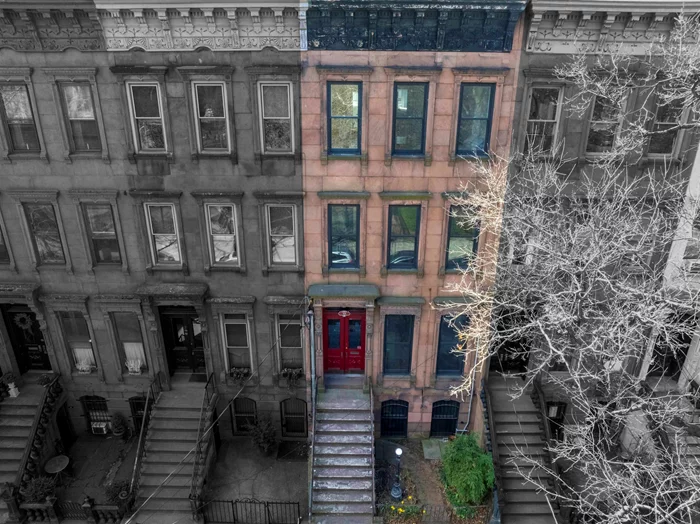 Circa 1875, this classic Italianate style brownstone, spanning 18 feet wide, faces the picturesque Historic Van Vorst Park, boasting a deep 100-foot lot. Upon entry, the double doors lead to a parlor level through an inviting vestibule featuring a mosaic tiled floor with stained glass door panels and transom, opening into a spacious foyer, a large living/dining area, and a well-equipped EIK with top-of-the-line Sub-Zero, Miele & Wolf stainless appliances and 9' soapstone island.  Enjoy access to the south-facing 13'x19' deck and garden from the kitchen bay and spiral staircase. The upper two floors showcase a primary bedroom with a wood-burning fireplace nestled in a sun-drenched bay window, complemented by a dressing area with original cabinetry and a marble top basin and three additional bedrooms, with one currently being used as a spectacular library/family room, an office/nursery, laundry, with new w/d, and two fully remodeled, high-end modern baths. The garden level, complete with a full bath, private entrance, and direct yard access, currently serves as a versatile home office and guest suite. This floor offers potential for long or short-term rental opportunities. Noteworthy features include 11' ceilings, seven etched slate mantels, plaster moldings, original shutters and cornices, intricate parquet floors with mahogany inlay and etched glass pocket doors. The property also boasts a spacious garden, full basement, central air on the lower three floors, custom O'Lampia lighting and newer Marvin windows and doors throughout, adding to its allure and charm.