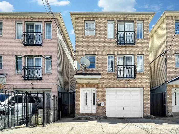 Welcome to this exquisite 3, 900sqft, 2-family home, built in 2006, and nestled in the vibrant Journal Square section of Jersey City, offering a unique blend of comfort, convenience, and versatility. Boasting two distinct units, this property presents an ideal opportunity for both homeowners and investors seeking a well-appointed residence with multifaceted living options. Ascending the grand entrance, you're greeted by a meticulously maintained exterior showcasing timeless architectural details. Step inside to discover an interior that seamlessly blends modern amenities with classic charm. The third-floor unit stands as the epitome of contemporary living, offering three spacious bedrooms and two full baths. The expansive kitchens feature sleek cabinetry, granite countertops, and stainless steel appliances, providing the perfect setting for culinary enthusiasts to indulge in their passion. Adjacent, the airy living room and dining room combination create an inviting space for relaxation and entertainment, adorned with ample natural light streaming through large windows. Additionally, the convenience of a dedicated laundry room adds to the practicality of daily living, ensuring effortless household management.  The second floor mirrors the third floor which has 3 bedrooms, 2 baths, living room, dining room and large kitchen but adds a first floor accessory unit which features, two-bedrooms, complete with a full bath, a well-appointed kitchen, and a comfortable living room.  The seamless connectivity between the first-floor and the second-floor, is facilitated by a convenient spiral staircase as well as separate outside entrances. This thoughtful design element allows for flexible living arrangements, enabling occupants to combine the first and second floors into a spacious duplex, ideal for those seeking expanded living space or intergenerational living options. For added convenience, the property includes a one-car attached garage, providing secure parking and storage space for residents. Outside, a charming backyard offers a serene escape from city life, perfect for al fresco dining or morning coffee amidst lush greenery. Nestled within the vibrant Journal Square neighborhood, residents enjoy unparalleled access to an array of amenities, including trendy eateries, boutique shops, and cultural attractions. With proximity to major transportation hubs, commuting to Manhattan and beyond is a breeze, making this location highly desirable for urban dwellers and commuters alike.