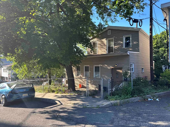 This Is A Charming Multi-Family House With A Partially Finished Basement, Detached Garage And Separate Driveway. Two Bedrooms On The First Floor, One And A Half Bathroom. One Bedroom One Bath On the Second Floor