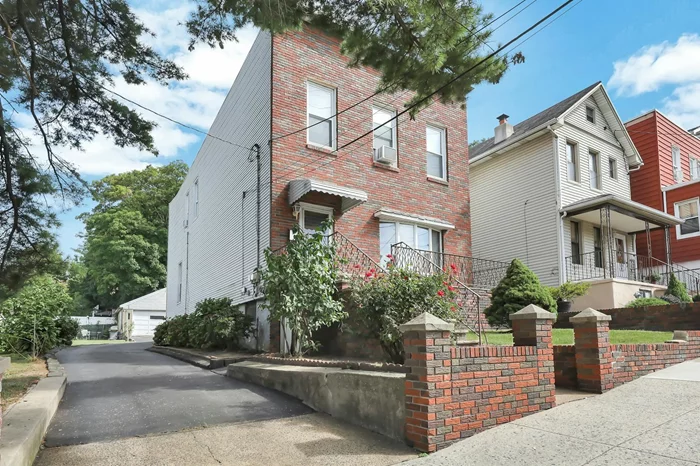 Brick front 2 family with detached 2 car garage on a large 50 x 133' lot. Opportunity for possible subdivision, add-on or live as is! Each unit has approx 10' ceilings, living room, kitchen, 2 bedrooms & bath. 1st floor has dining room, 2nd floor has small den off bedroom. Thermopane replacement windows. 1 gas hot water radiator heating system, 1 hot water heater. 3 gas meters, 2 electric meters. Lovely rear yard, 2 car garage has electric, long driveway can accommodate 6 cars. 2nd floor occupied month to month tenancy. Public transportation from house to NYC in under 20 min #127 or 154 Bus, 6 min walk to Tonnelle Ave Light Rail Station!