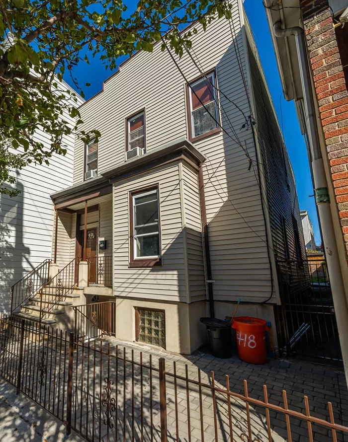 Great opportunity in Union city (Upper Hoboken) for homeowners, investors & NYC Commuters. This is a unique multifamily with 3 units with 4 bedrooms & 3 full baths, Sky-Light, 3 separate Gas & Electric Meters. Huge Backyard with side Entrance- perfect space to relax and entertain. It features 3 levels including a walk out ground level. This gem is minutes away from Light Rail 9th Street / Congress Street Station, 10-mins Public Transportation to NYC (Port Authority Bus Terminal), 7 minute-drive to Lincoln Tunnel. All copper water line & PVC Sewer line, Double hung Insulated Vinyl windows, Inter-connected Electric-Battery back-up fire alarm system in Hallways with Emergency light. Lead Requirement Certificate from Union city. First floor offers a modern gourmet Kitchen with stainless steel appliances & a breakfast bar with elegant lighting & laundry closet. First floor has an open layout with a living room, kitchen and dining area inundated with sunlight, perfect for social gatherings. 2nd floor has 2 bedrooms, living room, kitchen, full bath and a big closet. Ground level has a separate entrance with full bath, laundry room & a closet. Property is 3 blocks to Private Pre-school, Next to Day Care Center, walking distance to Elementary & Middle schools, 3 Blocks from FREE Olympic size Indoor Swimming Pool, 5 Blocks to FREE Public Tennis Court, Close to a variety of Restaurants & shopping stores & markets. Book your appointment today!