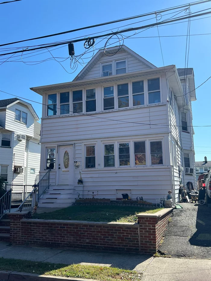 This amazing two family is the opportunity you've been waiting for. Both units have an identical floor plan with a large living room, formal dining room with decorative wood molding, two bedrooms, full bath, large eat in kitchen and a bonus enclosed porch. The finished attic provides additional living space for the second floor unit as it has a full bath. The unfinished basement has laundry, utilities, plenty of storage space and a fourth full bath. The rear staircase provides access to all floors. The property has separate utilities, driveway with parking for 4 cars, and a generous sized rear yard with storage shed. Easy access to major highways, transportation, shopping and more!