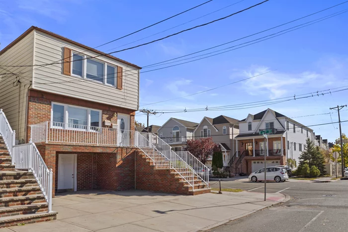 Best deal in Bayonne! Welcome to this spacious 3000+ sq ft two-family home, complete with an additional mother-in-law suite on the ground floor. Nestled on a coveted corner lot, this residence offers 7 bedrooms, 3 bathrooms, and 3-car parking, providing ample space for comfortable living and entertaining.  Inside, you'll find hardwood floors throughout the upper levels, where expansive, open-concept living, dining, and kitchen areas invite seamless interaction and connection. This contemporary floor plan design ensures you never miss a moment, even while cooking in the kitchen. Designed for modern living, the versatile floor-plan includes a converted garage space for more indoor living and storage that complements the already generous mother-in-law suite. This ground floor suite features a full kitchen, living and dining areas, a full bathroom, and a bedroom, offering an ideal setup for extended family or guests. With a roof that's just 8 years young and hot water heaters only 2 years young, this home is well-maintained and move-in ready. It boasts a Central Hot Air heating system and wall AC units for cooling, and the existing ductwork makes upgrading to Central AC a breeze. The master and second bedrooms are spacious enough to easily accommodate king-sized beds and come with ample closet space. Situated in the highly sought-after neighborhood of Bergen Point, this property offers privacy and plenty of outdoor space for barbecues and gatherings. Don't miss your chance to own this corner property that checks all the boxes at an attractive price. Welcome to your new home, where endless possibilities await. Certain photos are AI staged. Property will be delivered vacant at closing. With a price point to allow you to customize and maximize your return, this property will surely gain value over the years to come. Book your appointment today before someone else realizes this gem and makes it theirs.