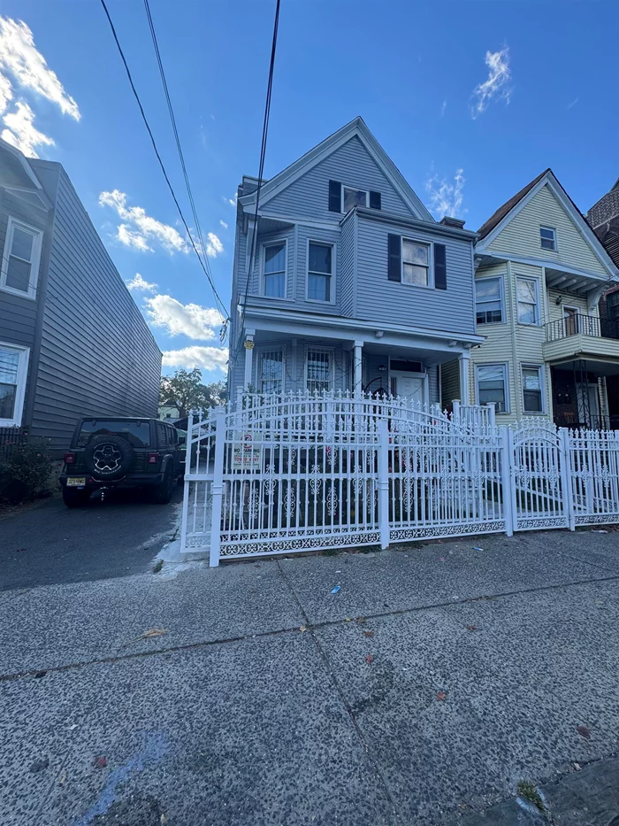 Two family house oversize lot with spacious parking and backyard, hardwood floors , lots of light. Central air full & finish Basement separate heat & hot water close to NJ transportations and minutes away from the liberty state parkway and major highways and turnpikes