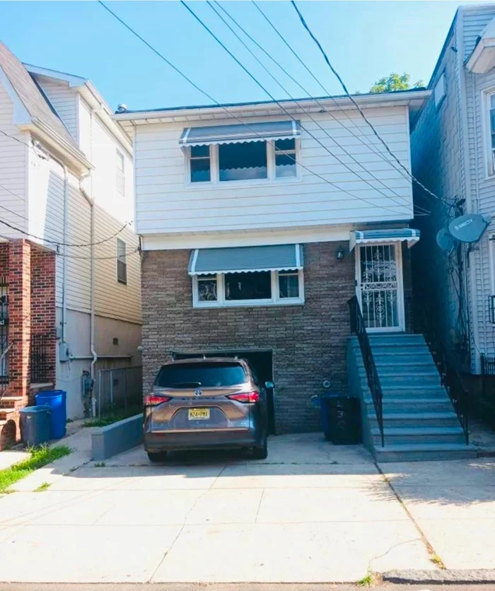 Detached 2 family house with full finish basement , separate heat & hot water hardwood flooring updated kitchen & bathroom with parking and backyard.