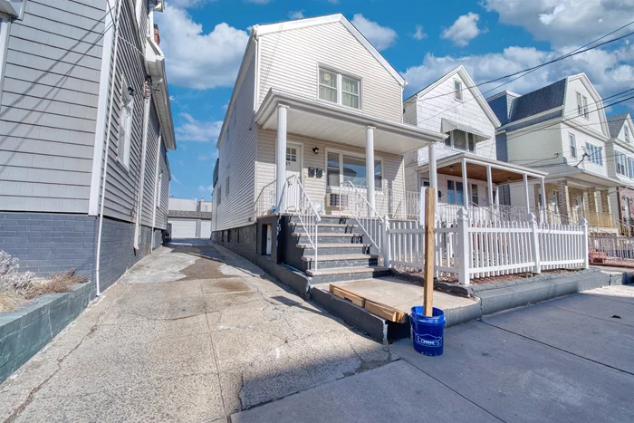 Welcome to this beautifully updated and renovated 2-family home in the heart of Bayonne, NJ! Offering modern upgrades and a prime location, this property is perfect for homeowners and investors alike. The home features 6 parking spaces, including a 2-car garage and 4 additional parking spots, providing unmatched convenience. Inside, you'll find updated appliances, stylish finishes, and a finished basement, adding extra living space and versatility. Outdoor spaces include a charming front porch and a private deck off the second-floor main unit, perfect for relaxation or entertaining. Located just minutes from the 22nd Street Light Rail Station, commuting to NYC and surrounding areas is a breeze. Families will love the proximity to Bayonne High School and Vroom Grammar School, as well as nearby shopping, dining, and parks. This move-in-ready home is a fantastic opportunity to enjoy Bayonne's vibrant community while benefiting from rental income potential. Don't miss outschedule your showing today!