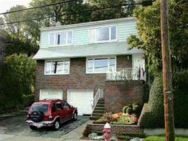 WEEHAWKEN 2 FAIMLY BRICK W/GARAGE AND CARPORT. SPECTACULAR HOME WITH NEW YORK CITY AND HUDSON RIVER VIEWS FROM BALCONY, LIVING ROOM AND BEDROOMS. TWO FAIMLY W/BONUS ONE BEDROOM APT. SITS ON CLIFFS W/PICTURE WINDOWS GLEAMING HARDWOOD FLOORS, OPEN, BRIGHT ROOMS INVITE YOU INSIDE, RELAX OUTDOORS IN LARGE INCREDIBLY BEAUTIFUL LANDSCAPED YARD. EASY FAST COMMUTE TO NYC VIA EASY ACCES TO LINCOLN TUNNEL, MANY EXTRA AMENITIES