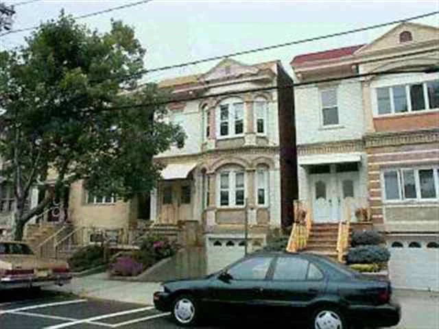 WEEHAWKEN 2 FAIMLY WHITE BRICK HOME ON GREGORY AVENUE. 5/6 ROOMS, A CAR GARAGE, SEPERATE FRONT ENTRANCES, NYC VIEW FROM 2ND FLOOR, 10FT CEILINGS LAUNDRY FACILITIES IN UNFINISHED BSMNT, ALUM WINDOWS, NEWER ROOF, YARD OVER LOOKING RESERVIOR