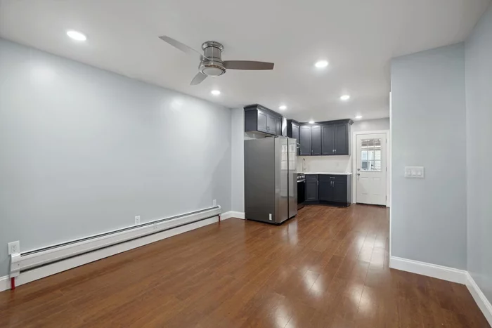 Completely renovated 2 bedroom 1 bath apartment with a spacious outdoor backyard centrally located a couple minutes from the path, public transportation to NYC, & shopping. This apartment features granite counter tops and an open layout. Don't miss out!