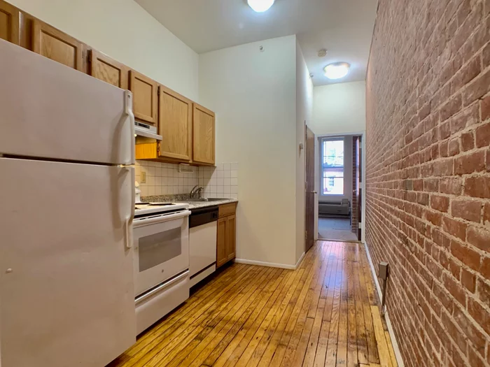 AVAIL 4/1 - Pet Friendly! Sunny 2 Bedroom, 2 Full Bath unit with hardwood floors. Living room includes exposed brick walls, very tall ceilings. Bedrooms are very private, nice kitchen, dishwasher. Laundry in building. Close to shops, restaurants, parks, mass transportation, and nightlife! You don't want to miss this! Pet Friendly! No Security Deposit option with Rhino Insurance.
