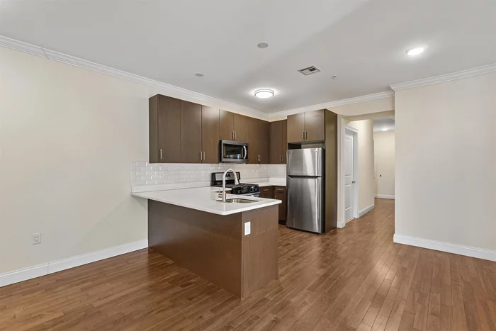 Welcome to The Avenue located at 4401 Bergenline Ave in Union City. Built in 2018, this well-kept building offers a spacious 3-bedroom apartment on the 3rd floor featuring maple hardwood floors, 10ft ceilings, stainless steel appliances with quartz countertops, large windows, an open floor plan with southern exposure, and spacious bedroom and bathrooms. Enjoy central air/heat, laundry in-unit, and an elevator in the building for your convenience. Bergenline Ave offers residents easy access to shopping, entertainment, nightlife, and transportation to NYC just one block away. Schedule a tour today. Price advertised is net effective rent. Landlord offering 1 free month on a 18 month lease.