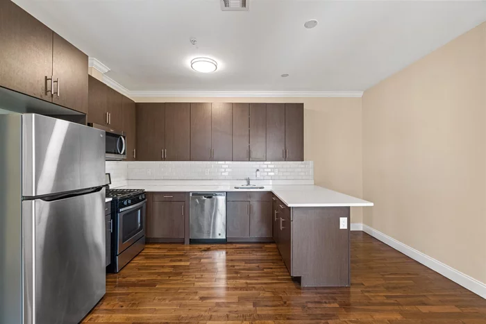 Welcome to The Avenue located at 4401 Bergenline Ave in Union City. Built in 2018, this well-kept building offers a spacious 3-bedroom apartment on the 4th floor featuring maple hardwood floors, 10ft ceilings, stainless steel appliances with quartz countertops, large windows, an open floor plan with southern exposure, and spacious bedroom and bathrooms. Enjoy central air/heat, laundry in-unit, and an elevator in the building for your convenience. Bergenline Ave offers residents easy access to shopping, entertainment, nightlife, and transportation to NYC just one block away. Schedule a tour today. Price advertised is net-effective rent. Landlord offering 1 free month on a 18 month lease.
