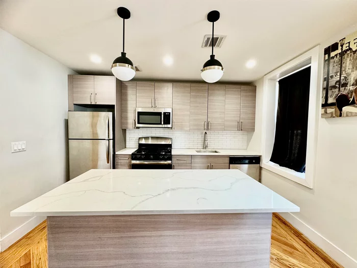 Beautiful Renovated 3 bedroom 1 bath apartment in Jersey City Heights. This unit features hardwood floors, quartz counter tops, stainless steel appliances, central air and heat, private deck and laundry in the building. Located less then 1 mile from Journal Square path station, 2 blocks Palisades Ave and Christ Hospital. Short term allowed 3-4 months minimum.