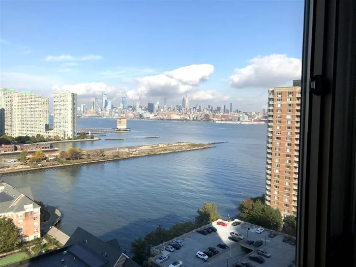 Stunning 1BD/1BA unit at luxurious Portofino. This apartment features views of Hudson River, mid-town Manhattan. The apartment measures 743 sq feet w parquet floors, nice appliances, huge pantry closet and enclosed Washer/Dryer. Portofino is a full service, pet-friendly waterfront building with 24 hr concierge, business center, gym, pool, tot-lot, community room, BBQ patio &seasonal shuttle to PATH. It has easy access to Newport Pavonia & Exchange Place PATH trains, Light Rail & Ferry. One parking is included in rent. Cable & High speed Internet is included in rent. Broker fee of 1-month rent to be paid by the tenant.