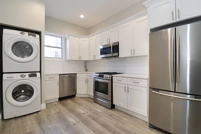 Recently renovated one bedroom apartment with covered parking available just a few blocks from the JSQ path (less than 1/2 mile to the Summit Ave entrance). Central Air controlled by Nest thermostat, full sized Washer/Dryer, high end stainless steel appliances including gas stove, dishwasher, microwave, and large french door refrigerator. White quartz countertops along with white shaker cabinets. Lots of drawers and cabinet space. Large rooms, pre-wired for cable/internet, built in USB power outlets. Additional storage in the basement. Ask for the 3D tour!