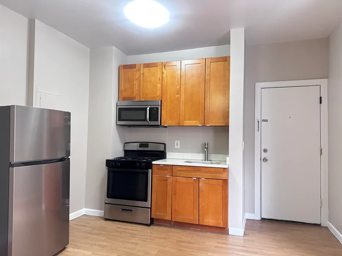 This cozy 1B1B apartment is just a short walk from the Journal Square PATH station, making it ideal for commuters. It features hardwood floors throughout, a gas stove, and new pendant lights. Rent includes heat and hot water, and there's a shared laundry room in the building. No Broker Fee!
