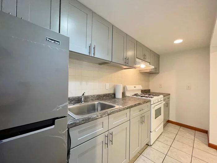 This spacious two bedroom apartment has been recently renovated. Kitchen with new appliances including refrigerator and gas stove. One driveway spot is included right in front of the house. Close to transportation including NYC bus, PATH train, and Lincoln tunnel, makes this great for commuters who can also enjoy it's close proximity to shopping on Central Ave and nearby parks including Leonard Gordon Park and Pershing Field Park. Available ASAP! Ask to see the virtual tour!